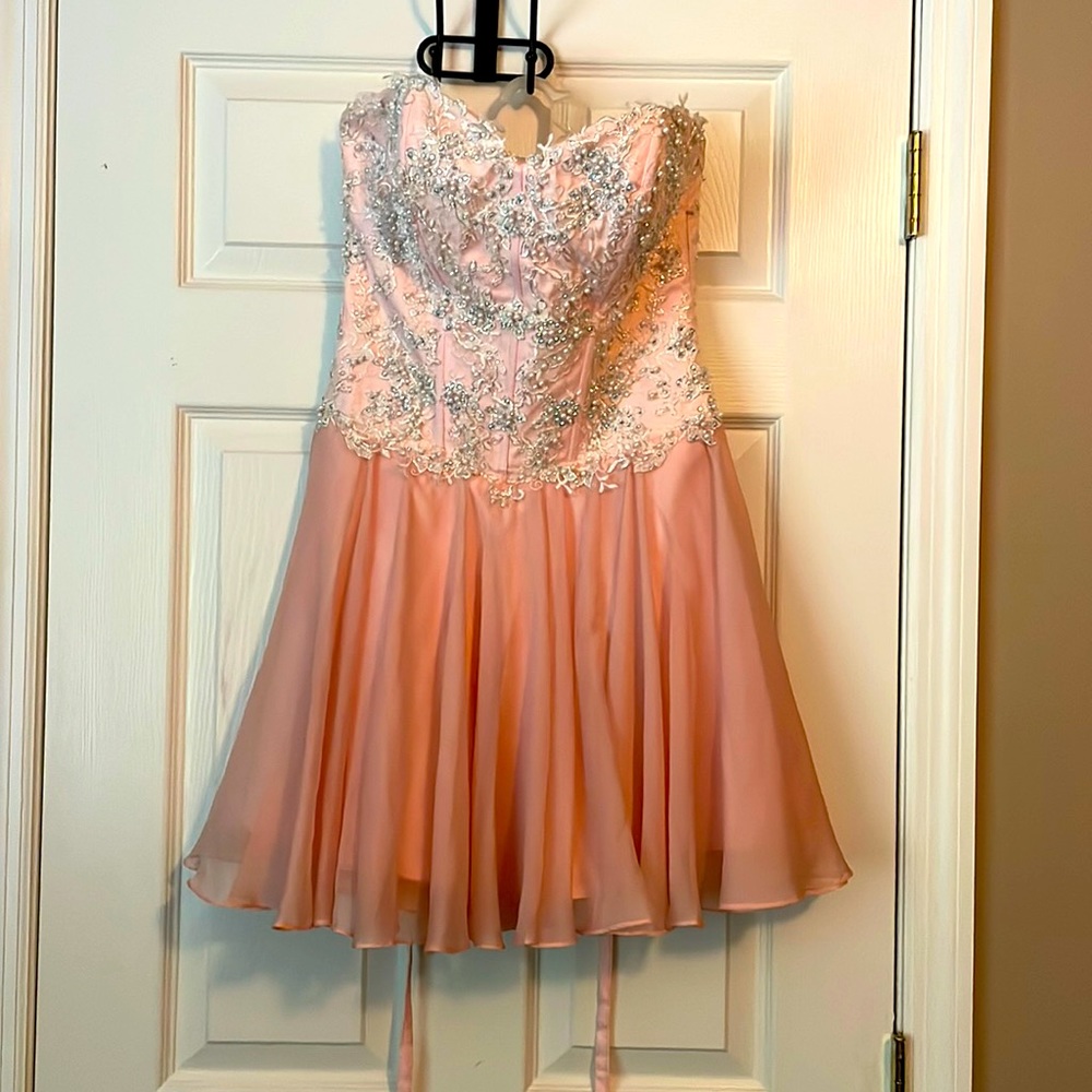 Prom/party dress. Side zip, lace up back, color is blush with delicate beading
